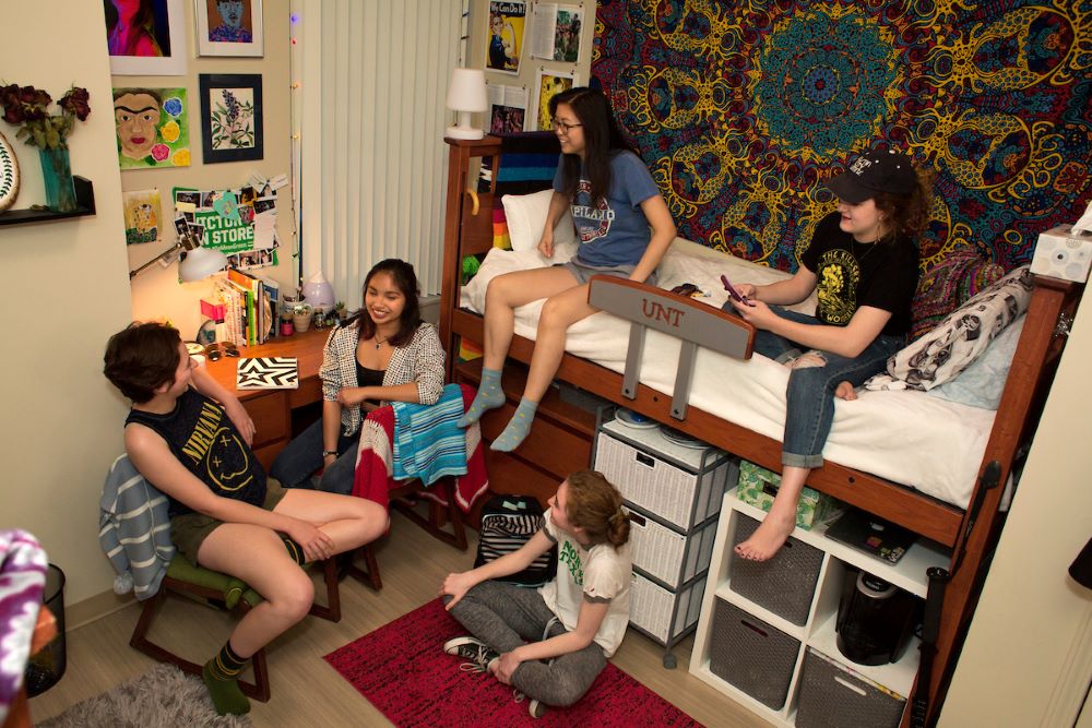 students hanging out in a decorated hall room 